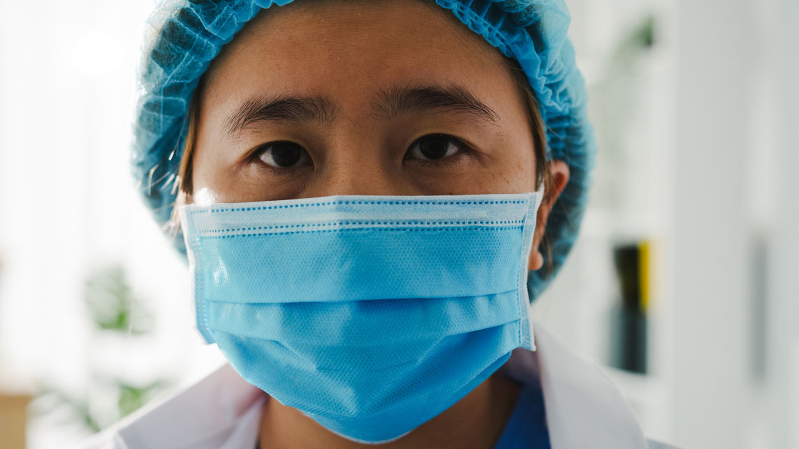 picture of a female health worker with a mask