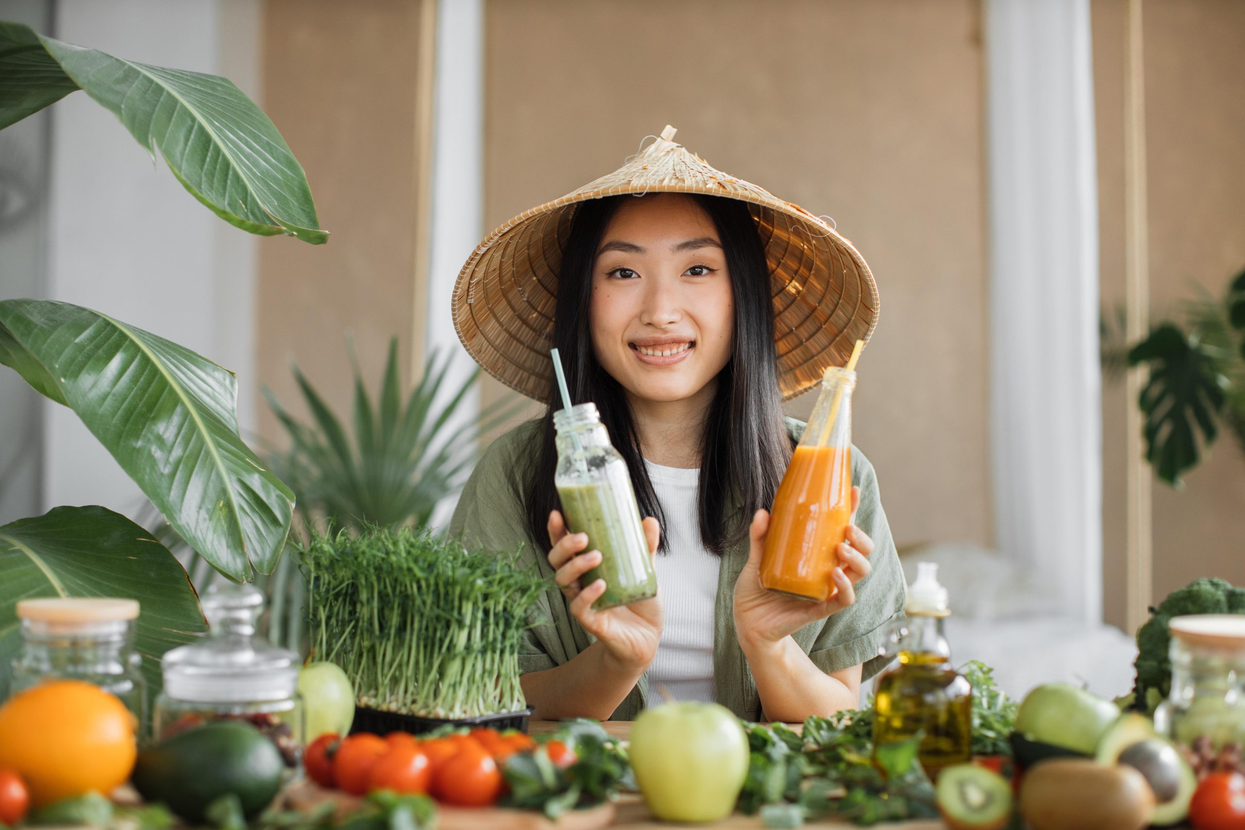 girl with smiling with fruits and vegetables on her table