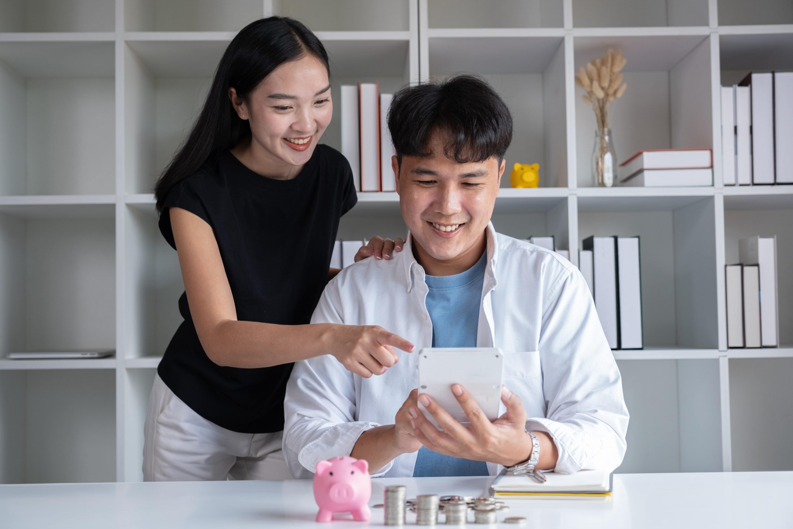 happy couple saving money for colonoscopy