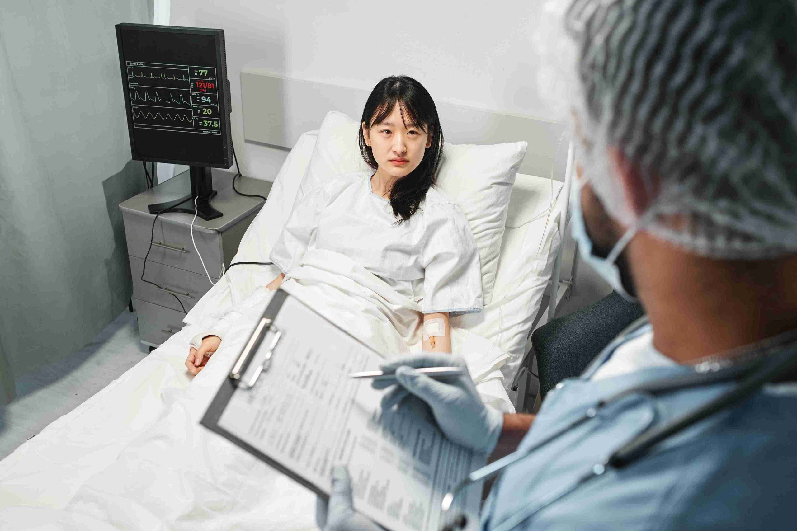 female asian patient lying in the hospital