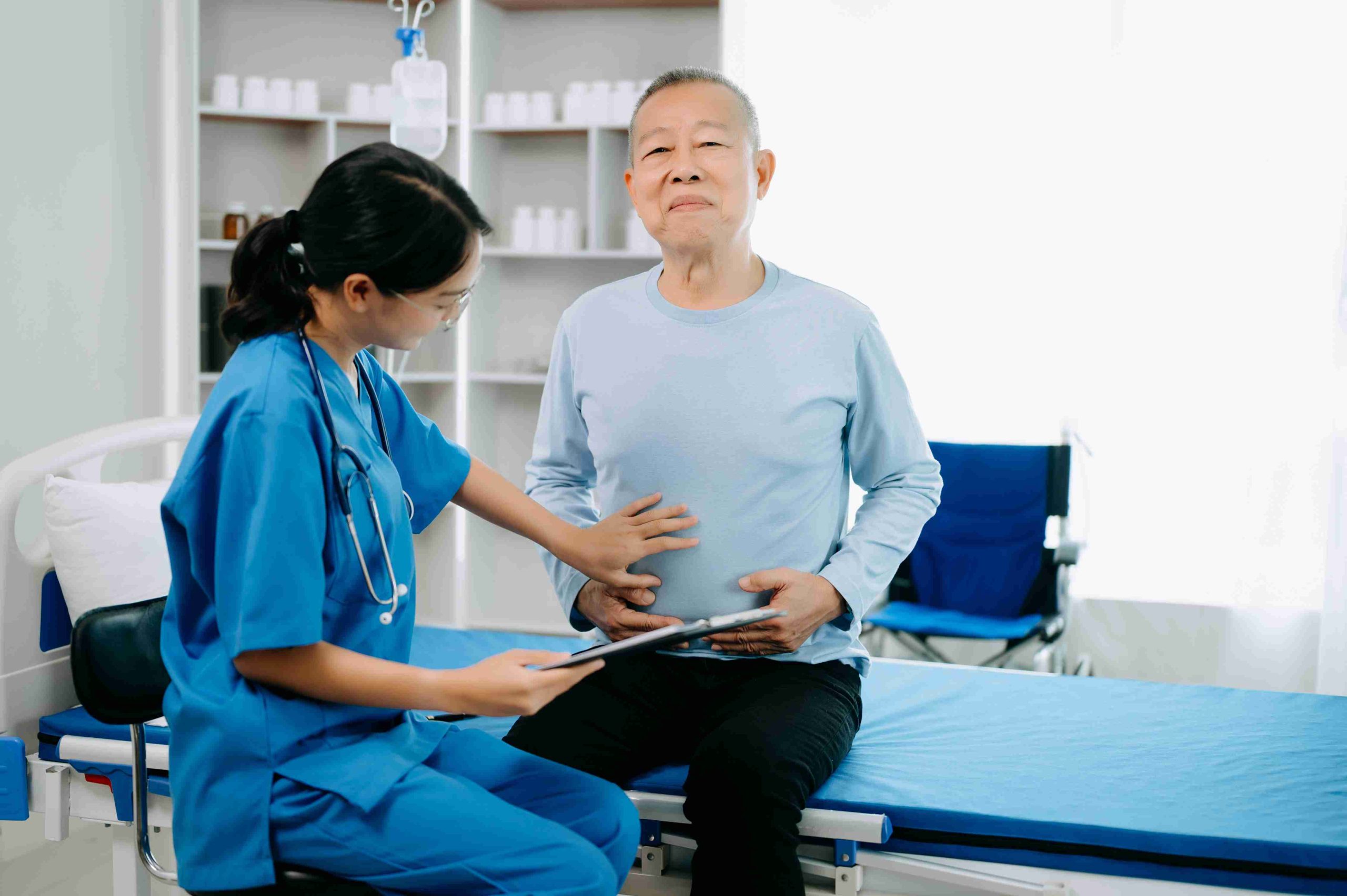 female doctor examining a patient's stomach