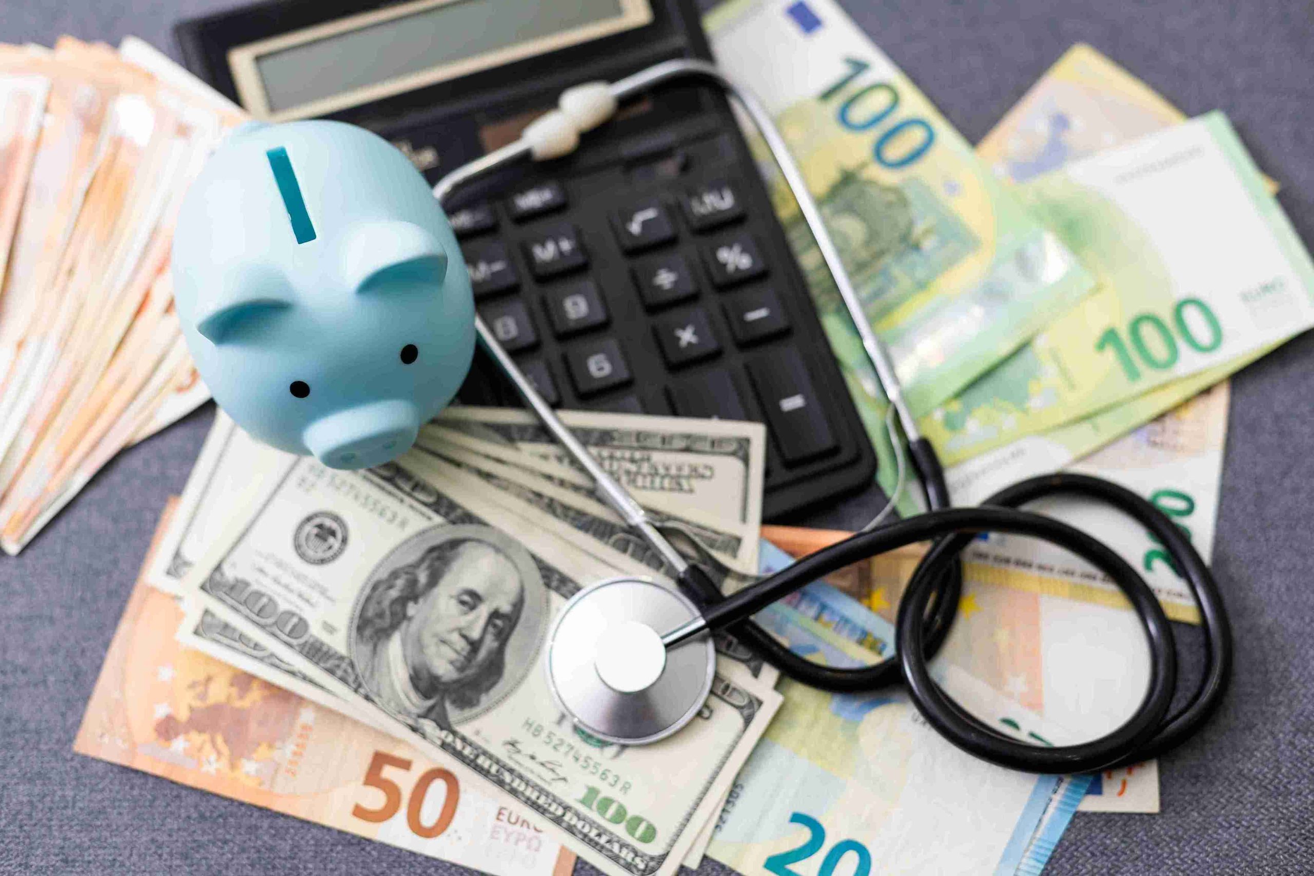 picture of endoscope, money, piggy bank, and calculator