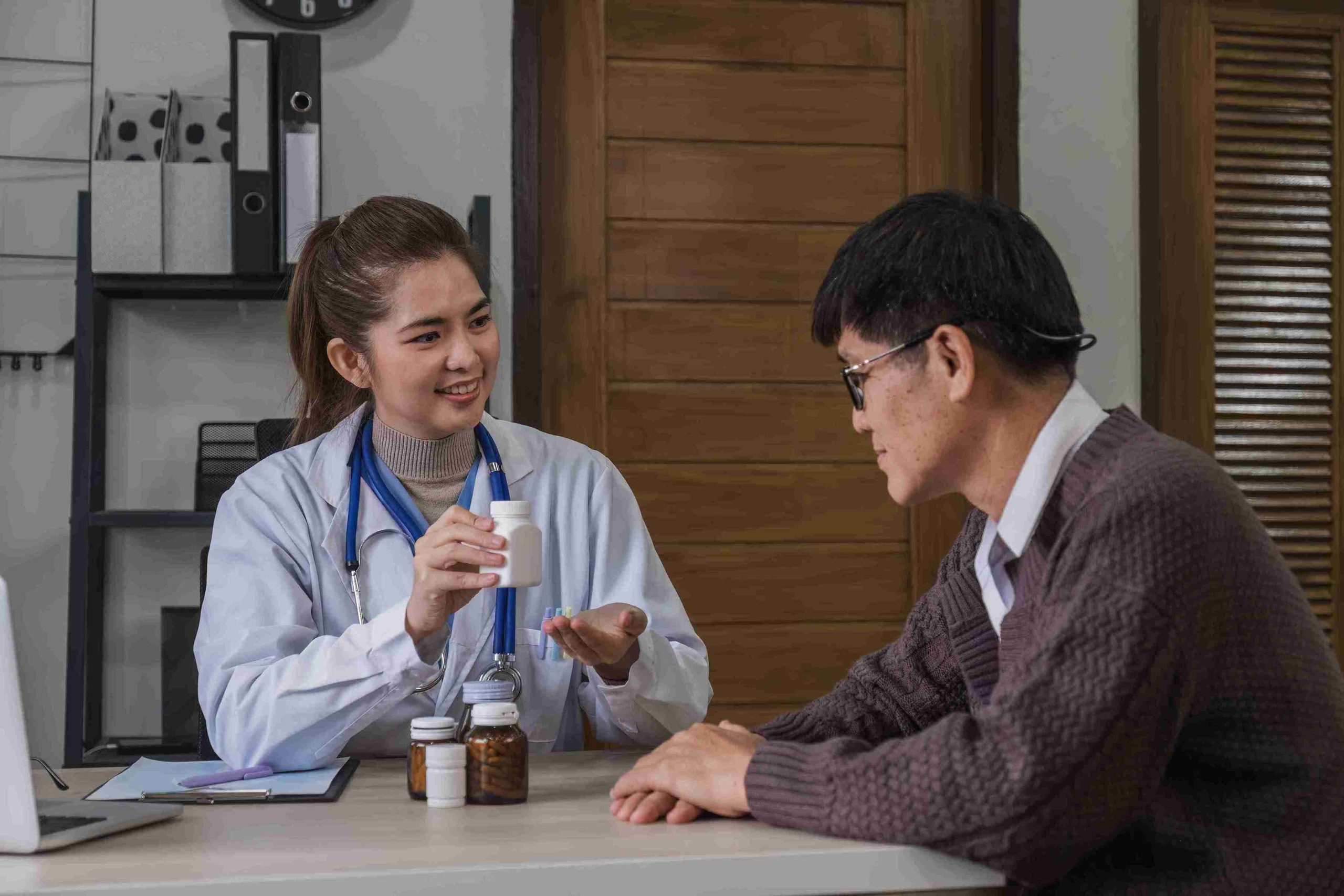 doctor showing a patient some medications