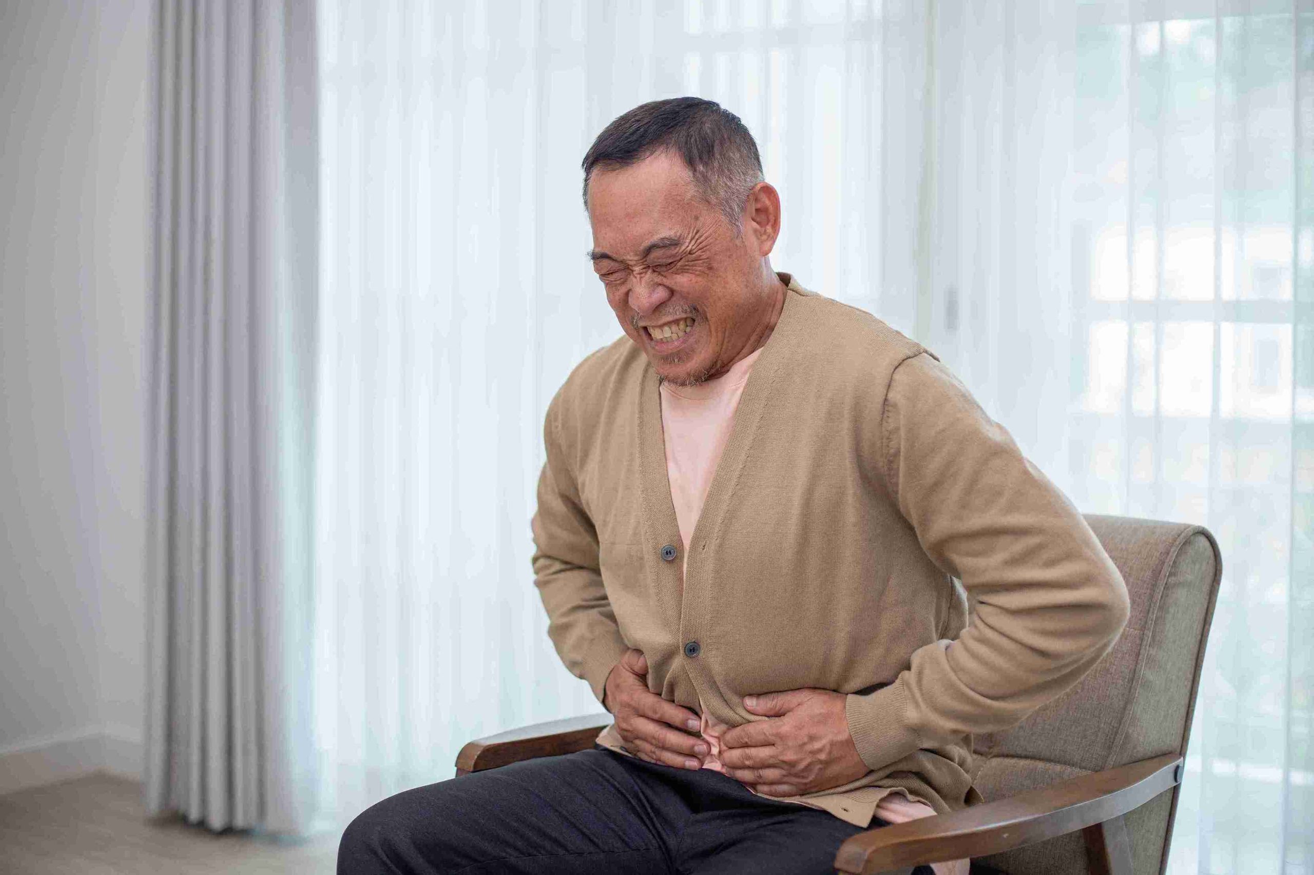 elderly man with severe stomach pain