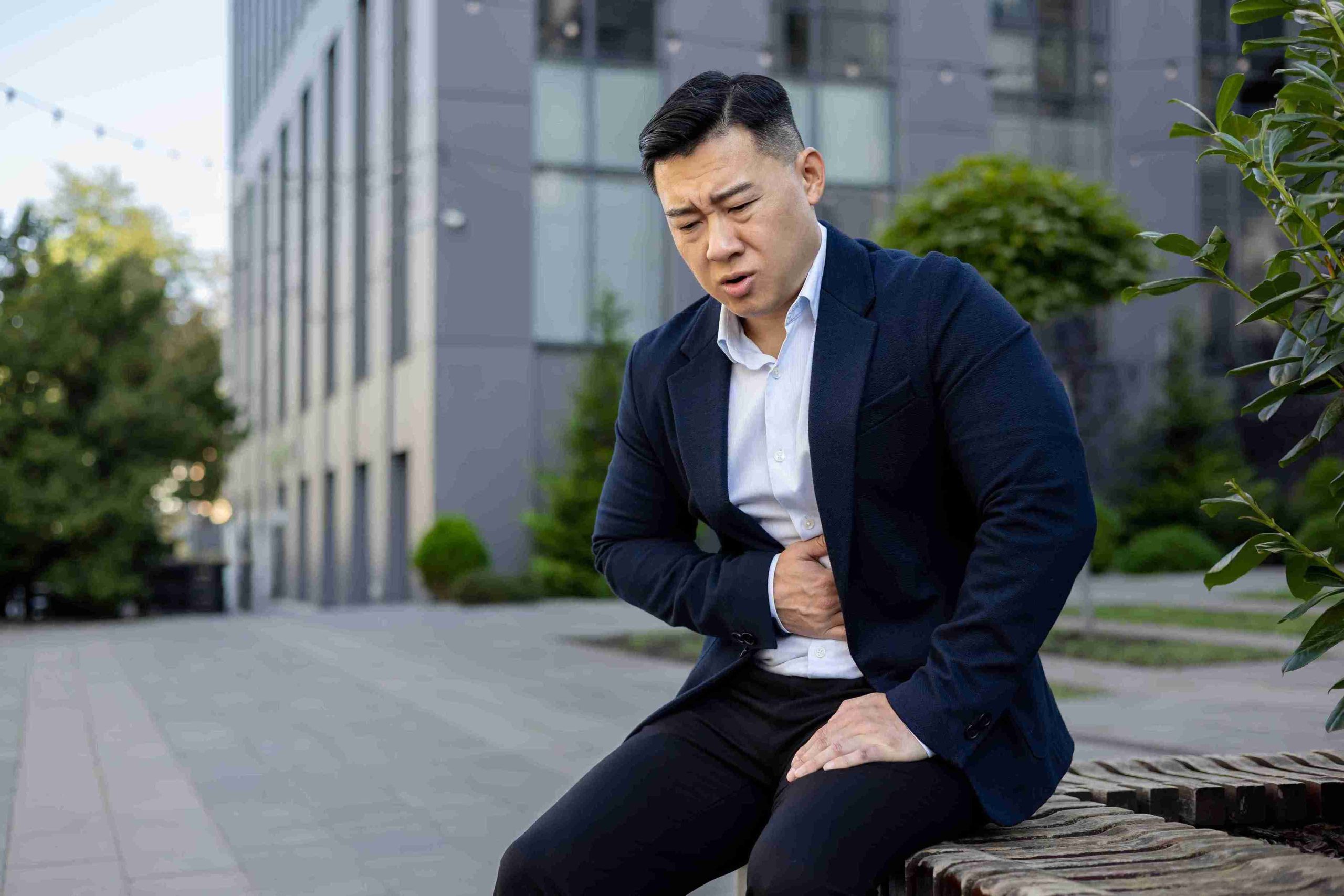 businessman feeling chest pain for GERD