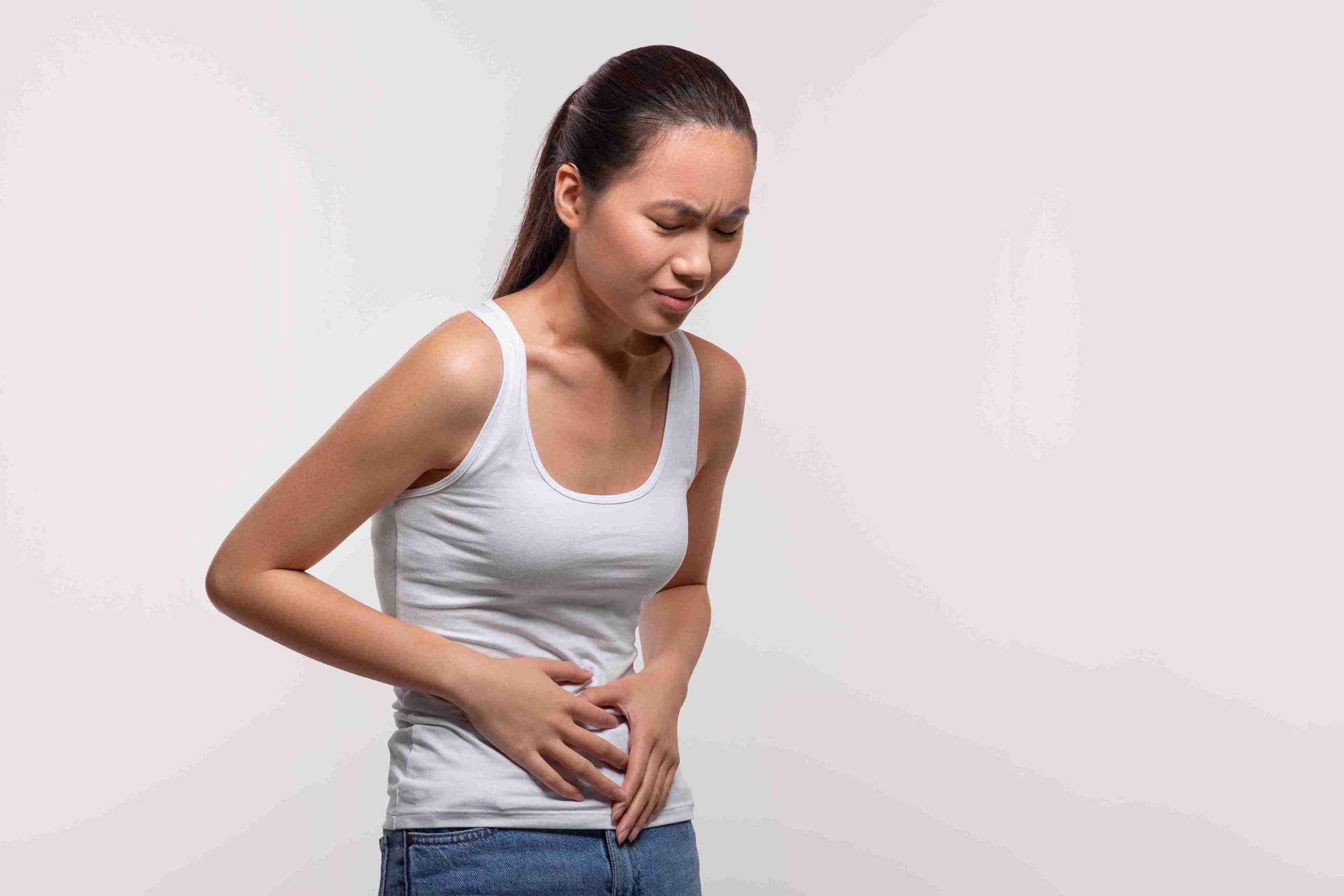 woman suffering from stomach pain