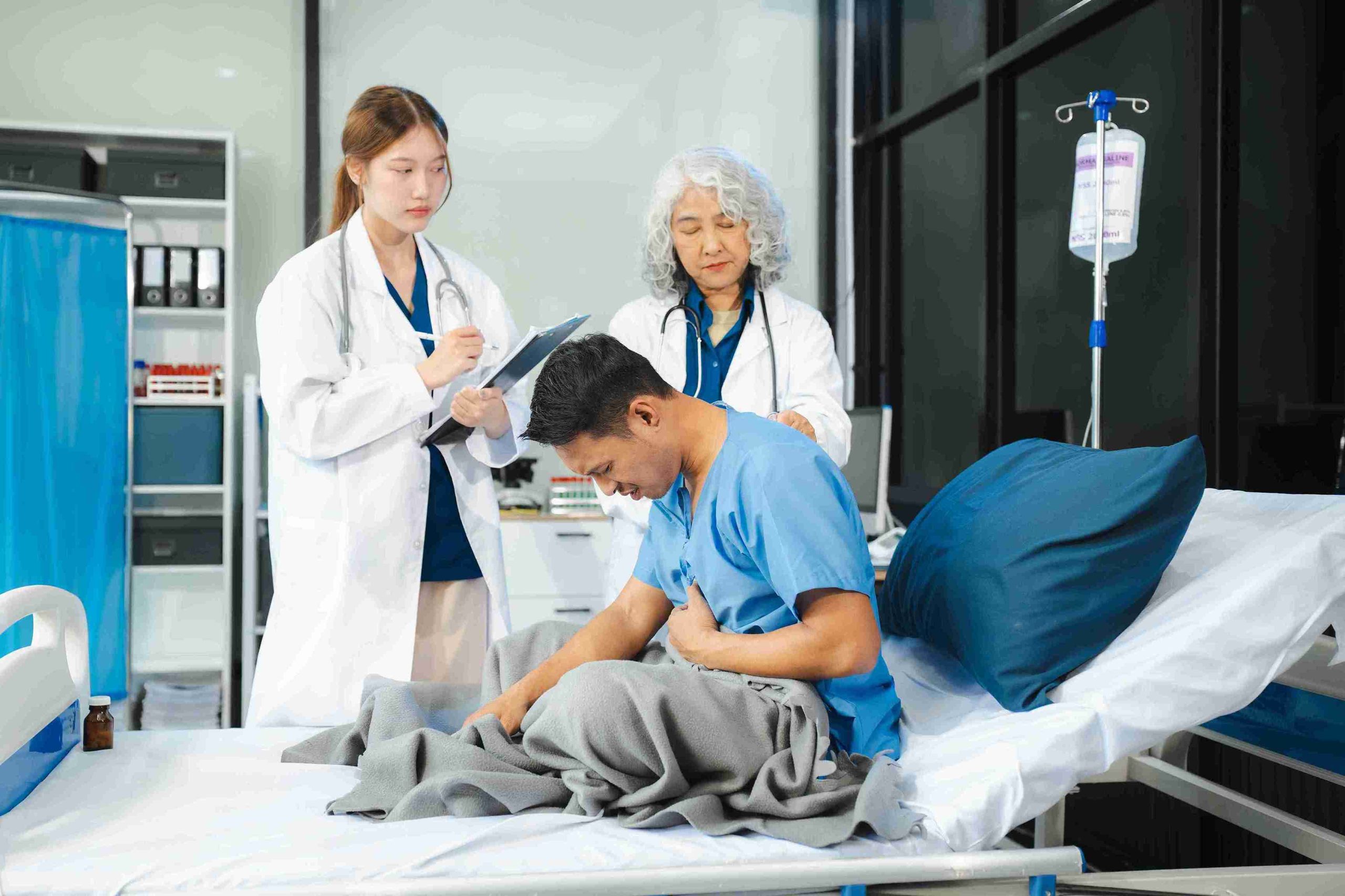 male patient sitting in the hospital bed