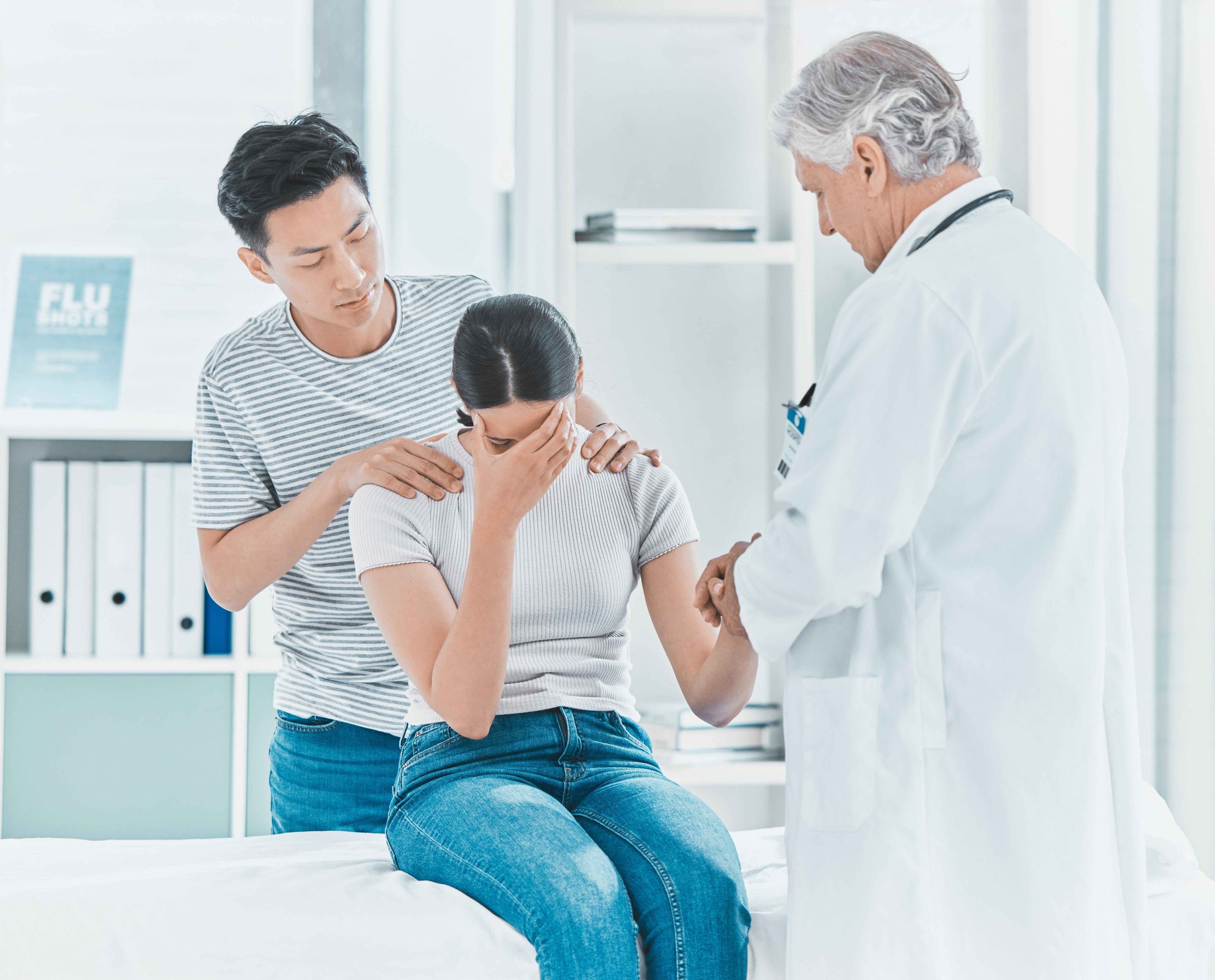 anxious patient being comforted by doctor