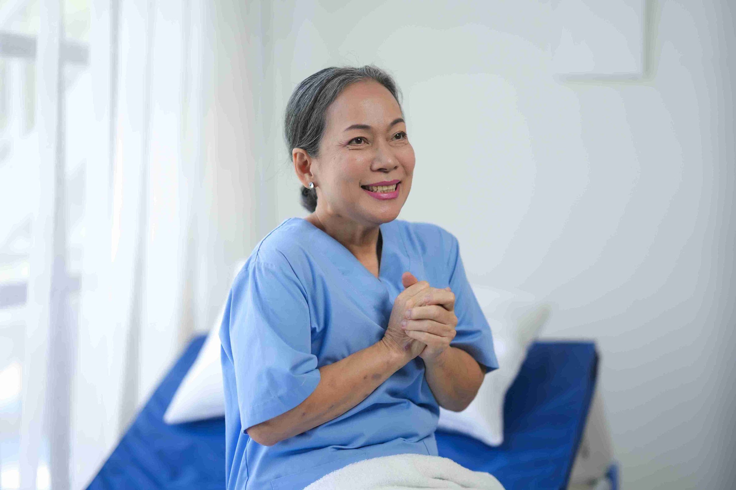 patient in bed smiling