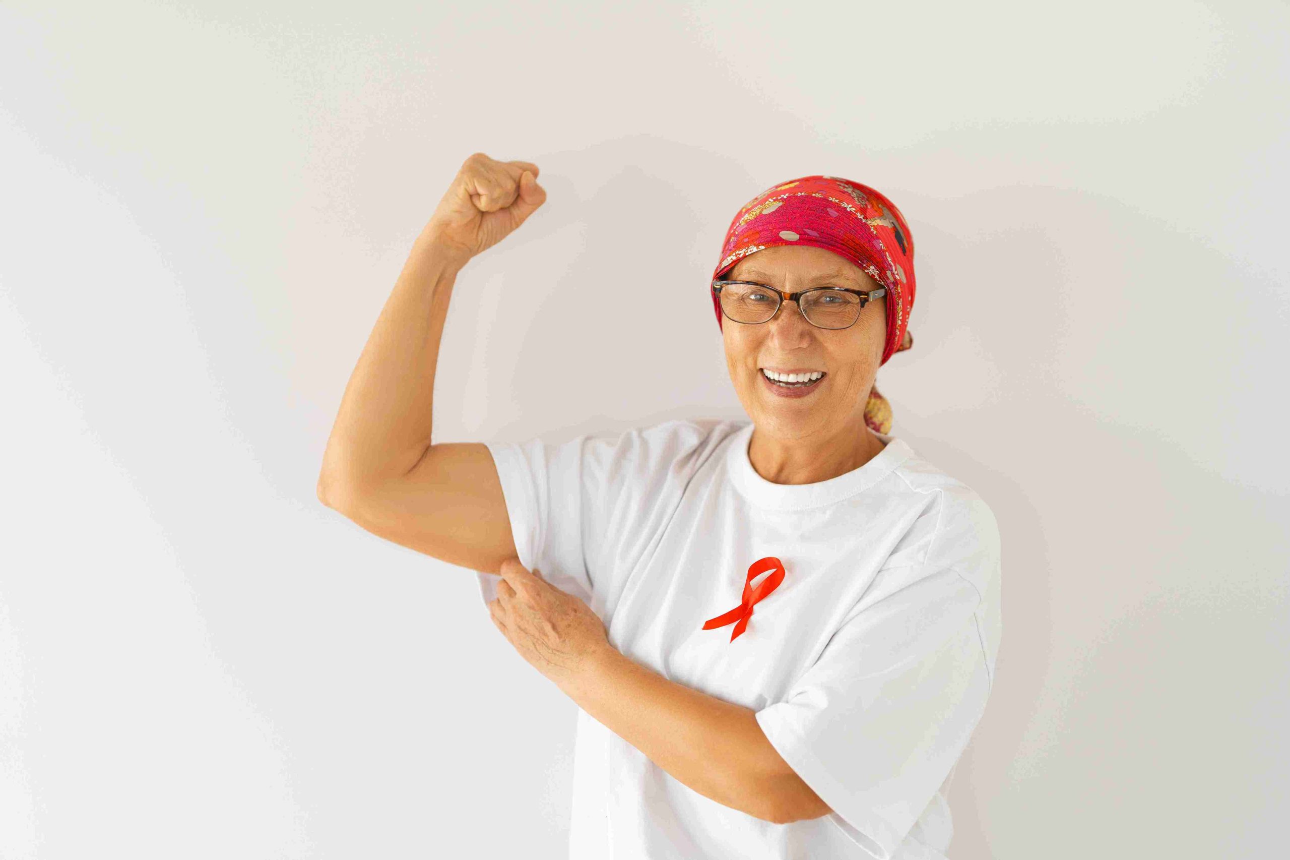female cancer patient flexing to the camera