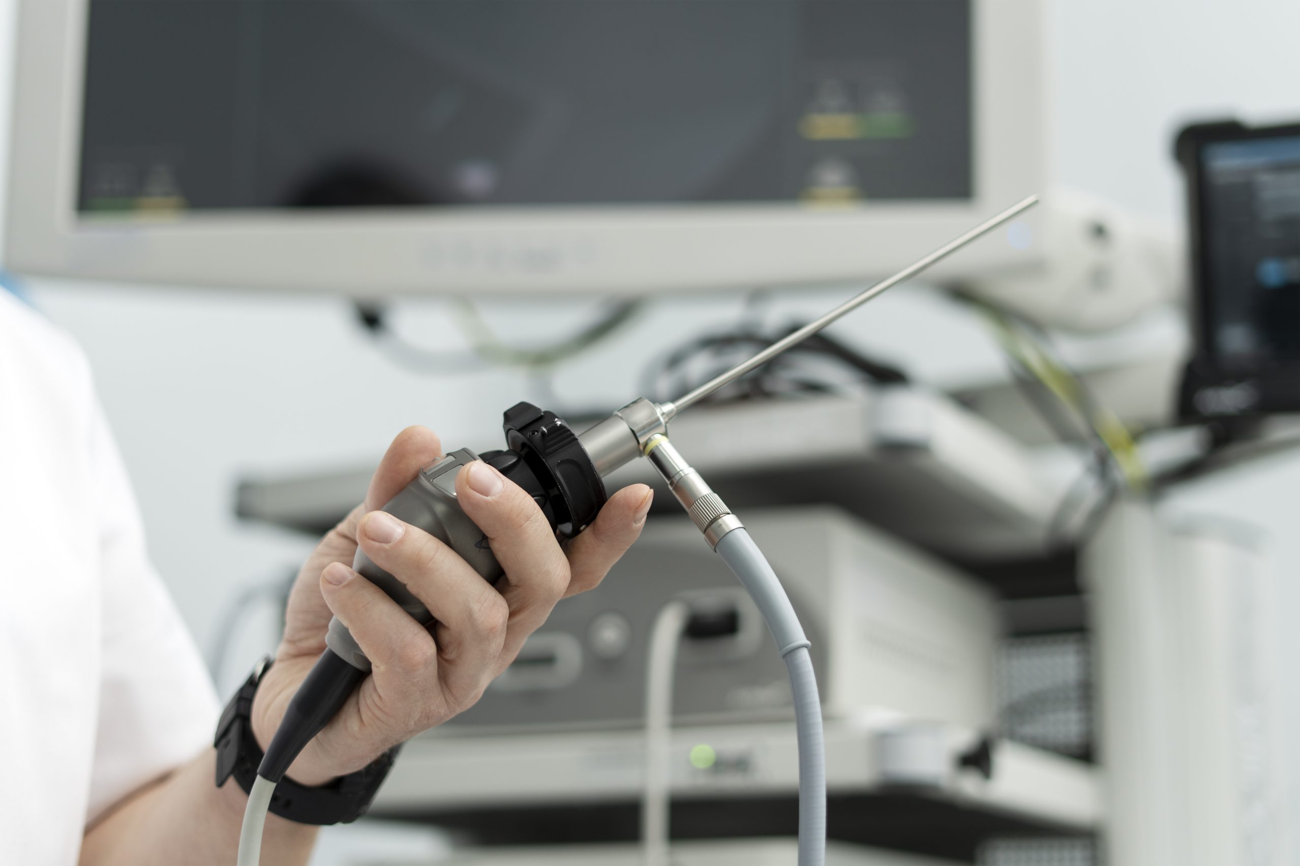man holding a medical endoscope