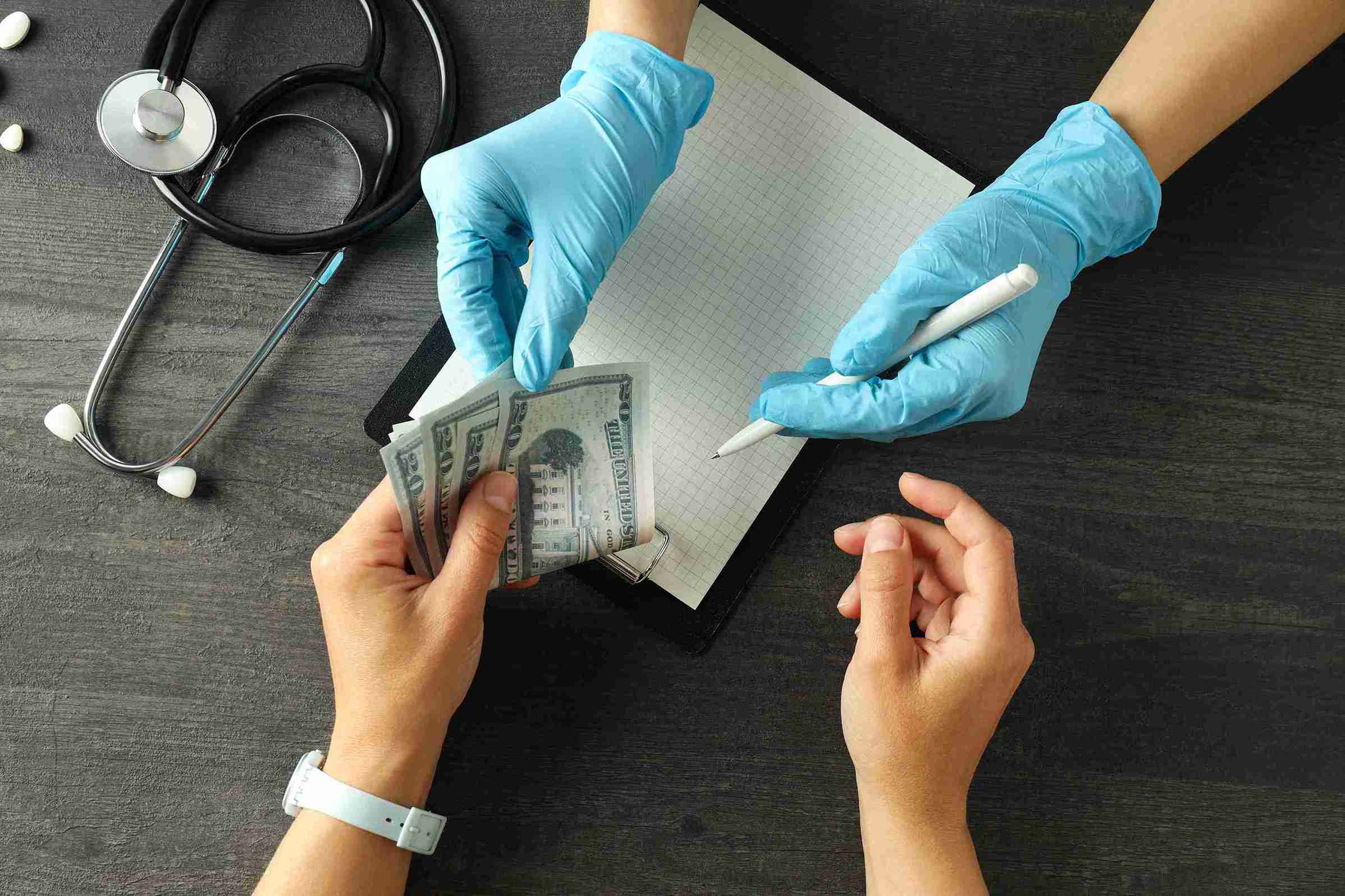 patient giving money to healthcare worker