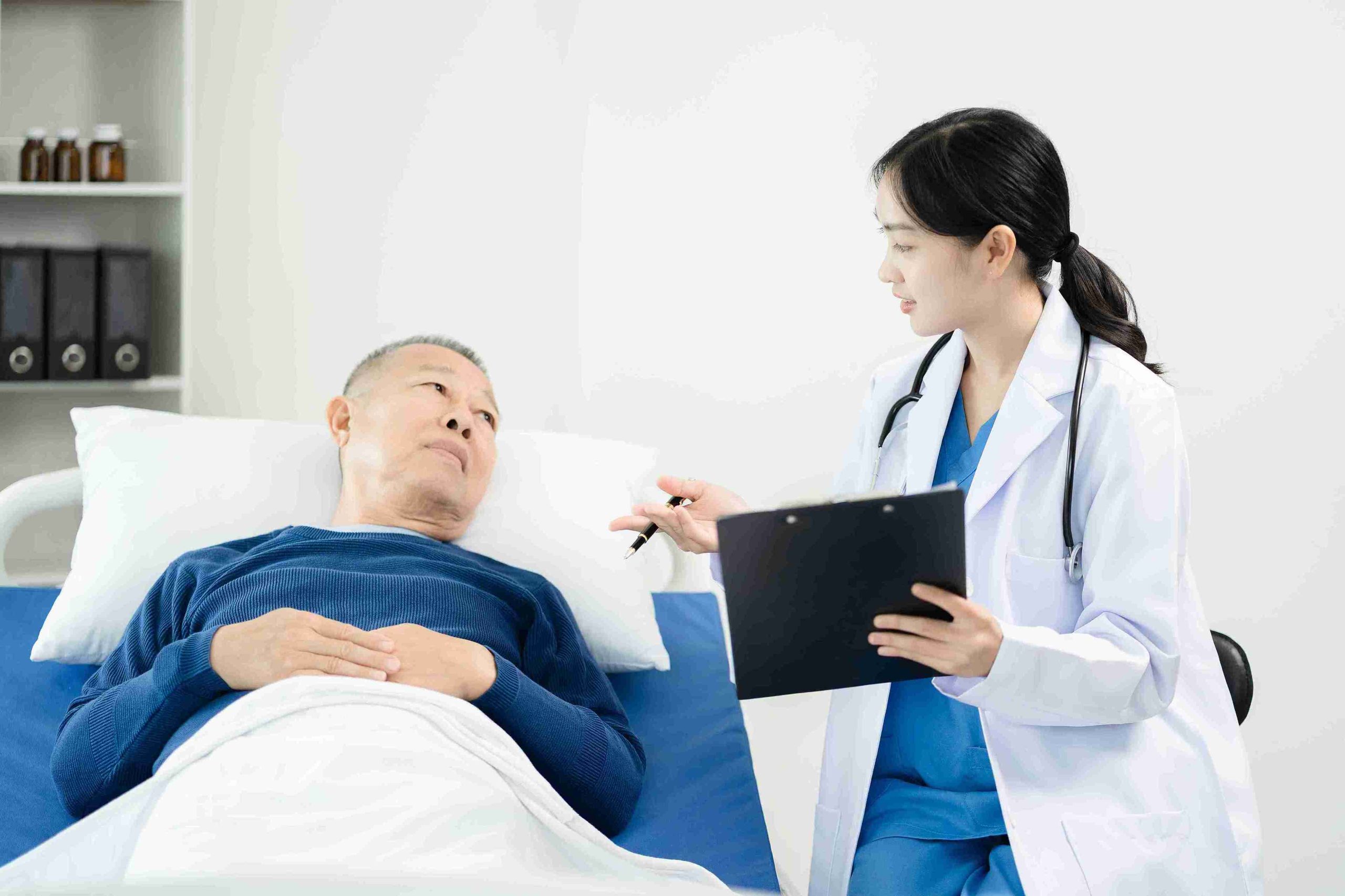 Female doctor discussing with the patient FAQs of endoscopy.