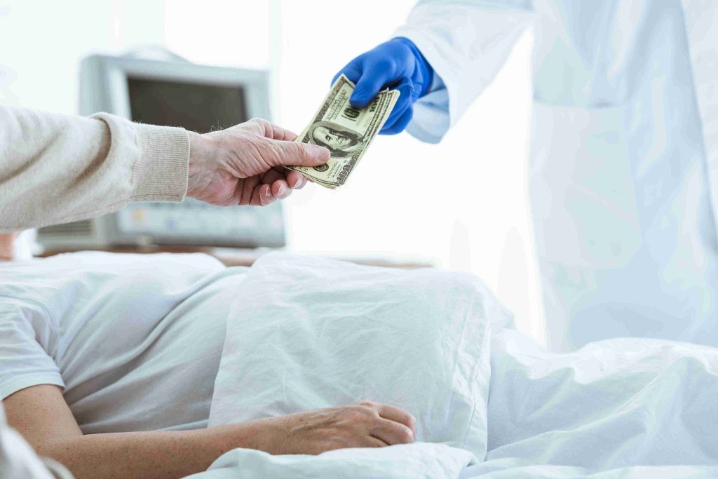 Kin of patient handing over money to doctor.