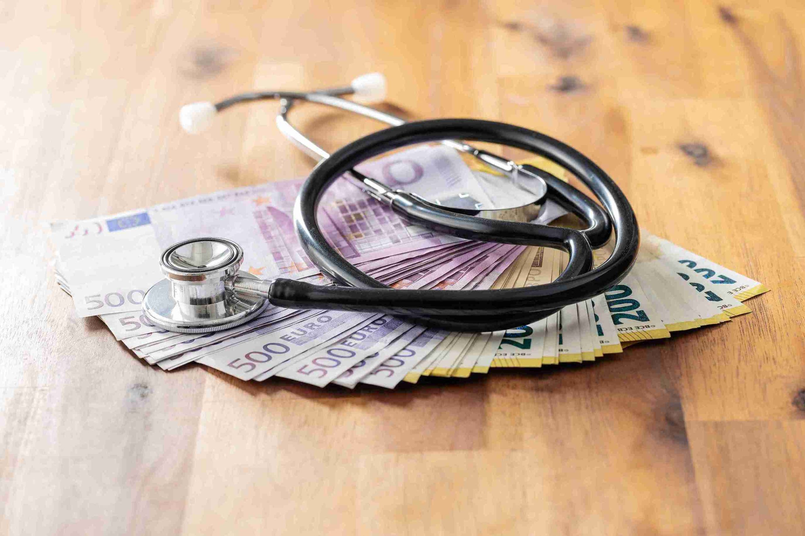 European money with stethoscope on top.
