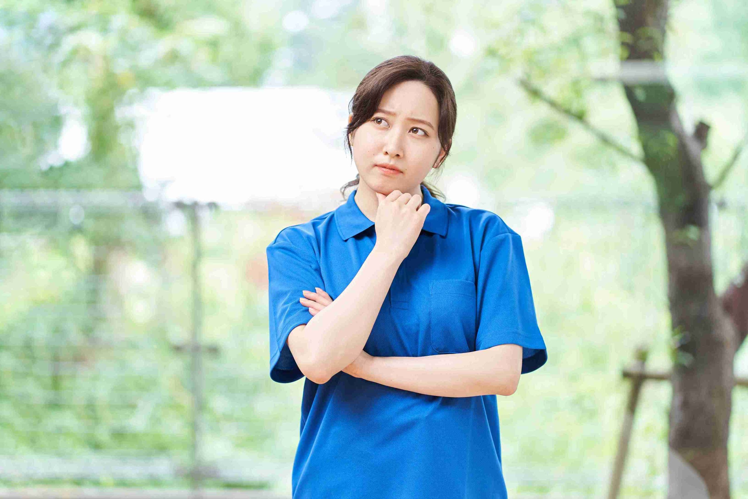 Female patient thinking about the frequency of colonoscopy screening.