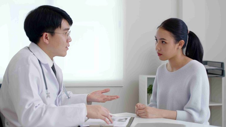 Doctor explaining things to a patient.