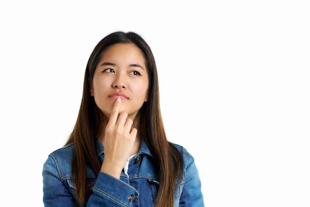 Asian woman thinking about something.