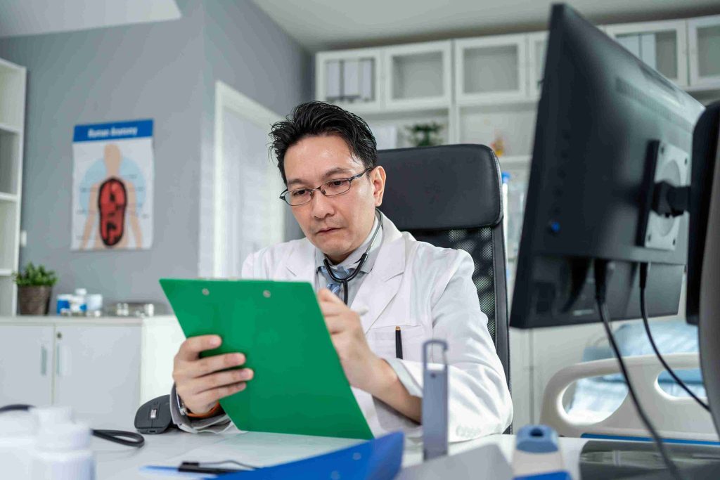 Medical doctor analyzing some test results.