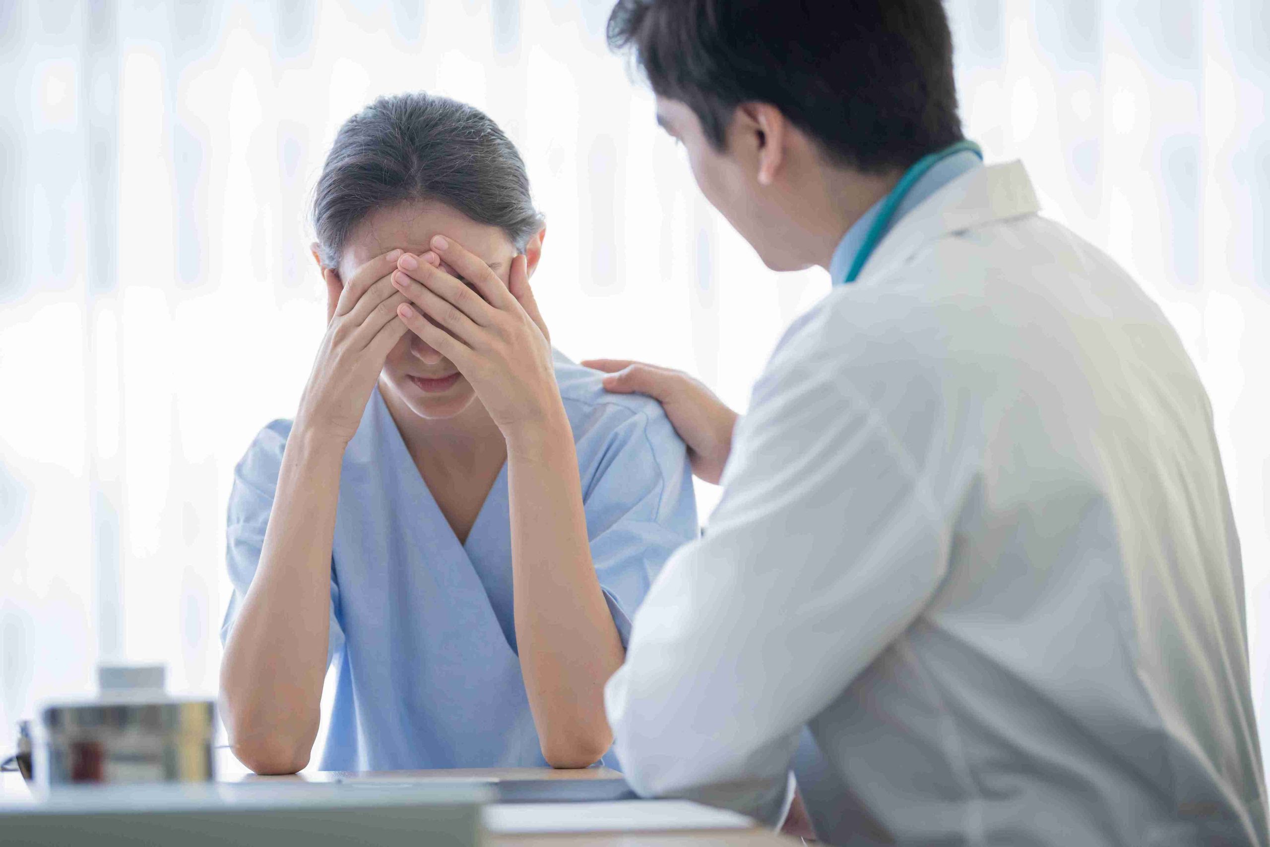 Doctor speaking with a fearful patient.